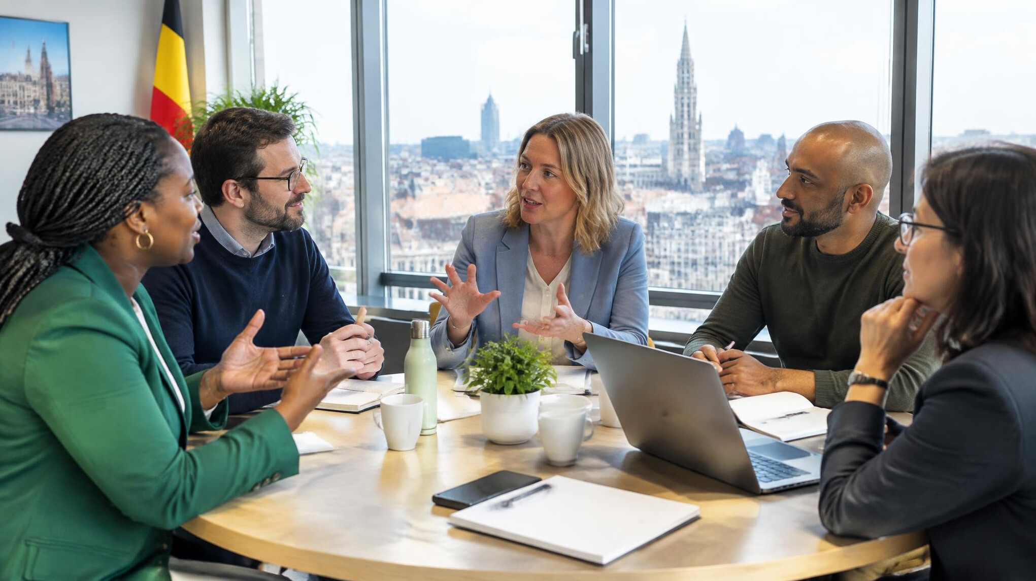 Group of professionals having an open discussion in a bright meeting room